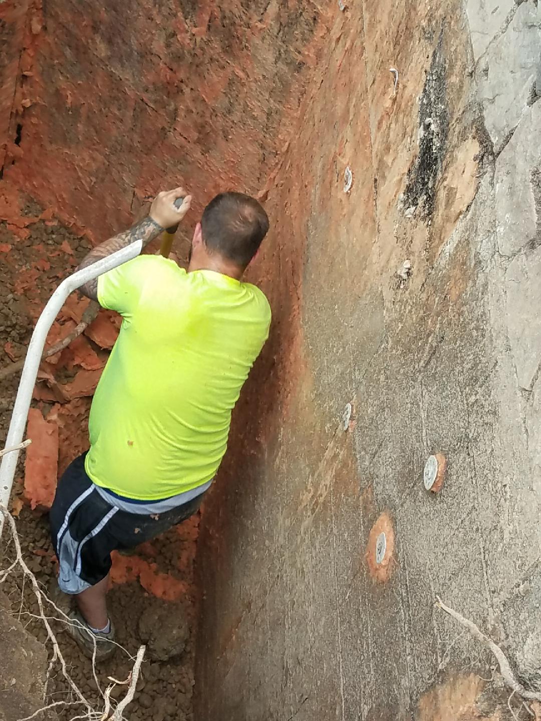 Digging around foundations to fix basement water problem